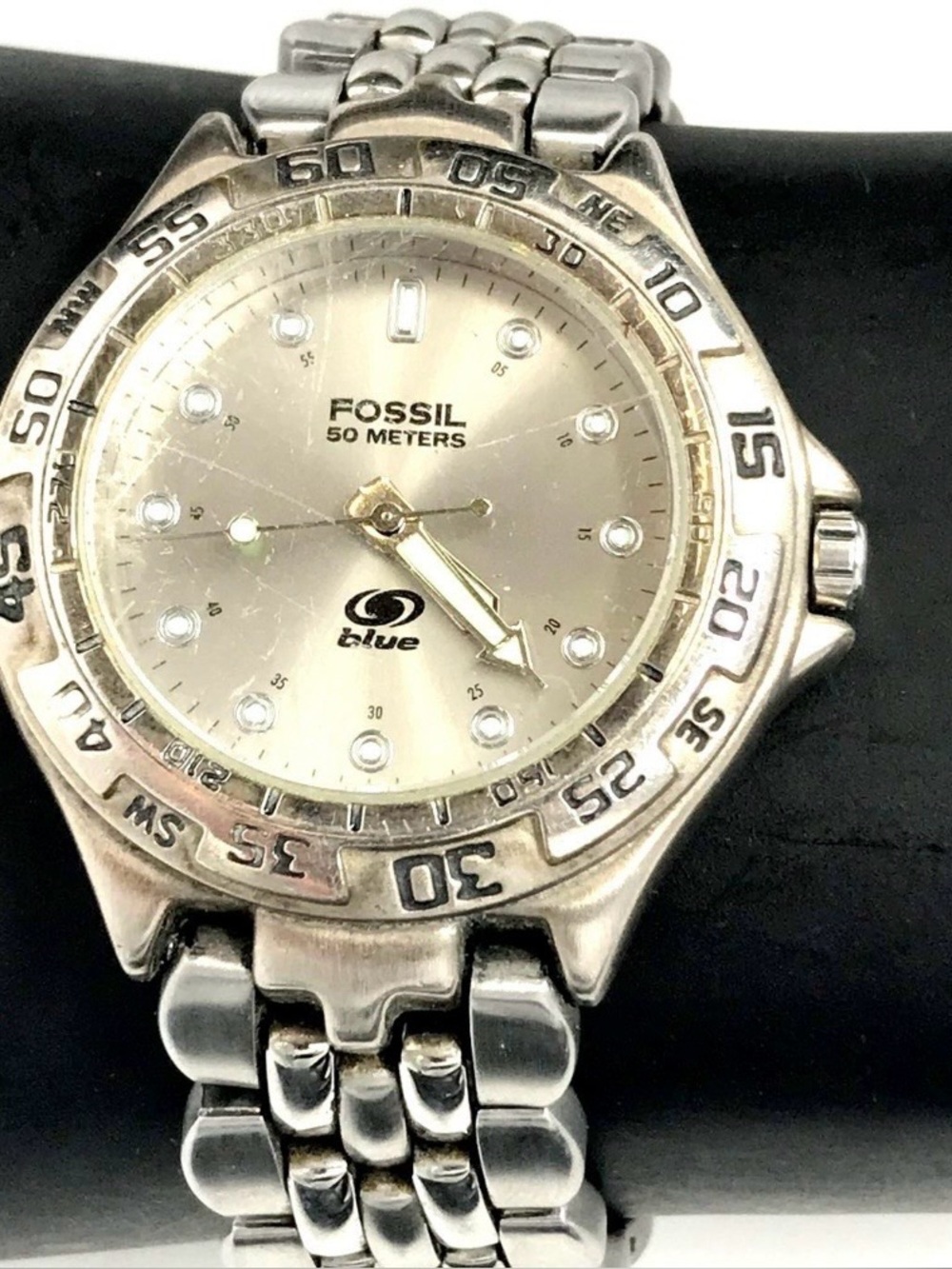 Fossil Blue stainless steel wristwatch w/champagne dial and a rotating bezel